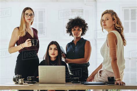 Group Of Multiracial Businesswomen In Casuals Together At Office Desk