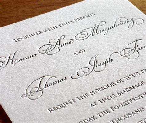 The Wedding Stationery Is Laid Out On Top Of Each Other And Ready To