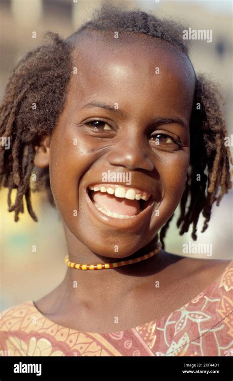Burkina Faso Ouagadougou Laughing Girl With Traditional Hair Style