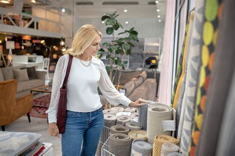Premium Photo Carpets And Rugs Serious Woman In A Furniture Store