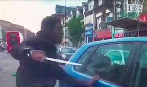watch terrifying video shows furious cyclist pulling huge knife at driver uk news express