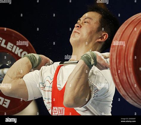 Guozheng Zhang Of China Lifts In The 69 Kilogram Weight Class Of Group A At The World