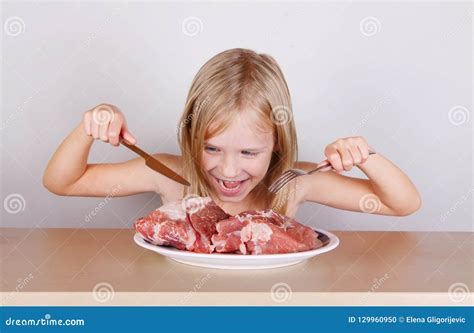 Carnivore Keto Diet Concept Little Blond Girl Eating Raw Meat Stock