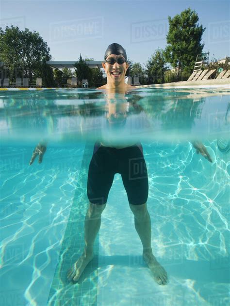 Asian Man Standing In Swimming Pool Stock Photo Dissolve