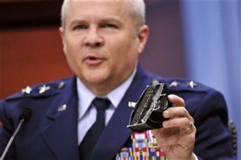 Maj Gen Charles Lyon Holds Up A Hepa Filter While Talking About The Oxygen Delivery System Of