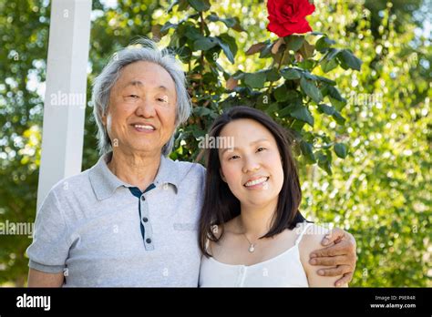 Chinese Father And Daughter Outdoors Stock Photo Alamy