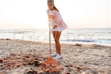 Cropped Image Of A Babe Woman Volunteer Cleaning Beach Stock Image Colourbox