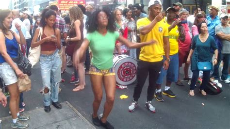 brazilian girls dancing street samba at the beats of brazilian samba drum beats new york city