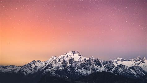 1600x900 4k Starry Sky Above Snow Covered Mountains 1600x900 Resolution