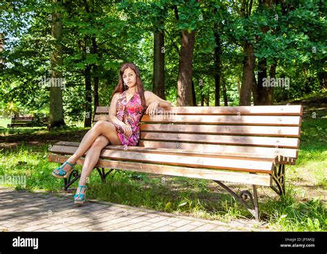 Lady Sitting On A Park Bench Stock Photos And Lady Sitting On A Park