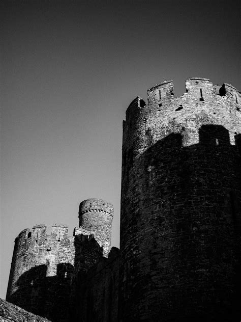 Grayscale Photo Of A Concrete Castle · Free Stock Photo