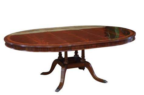 Curved pedestal base dining table with 12 in. Round to Oval Dining Room Table | Round Dining Table with Leaf