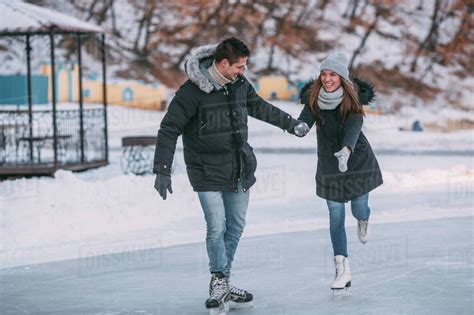 Figure ice skates skate 3 ice girls ice skaters ice dance ice art ice princess figure skating dresses winter olympics. Full length of happy couple holding hands while enjoying ...