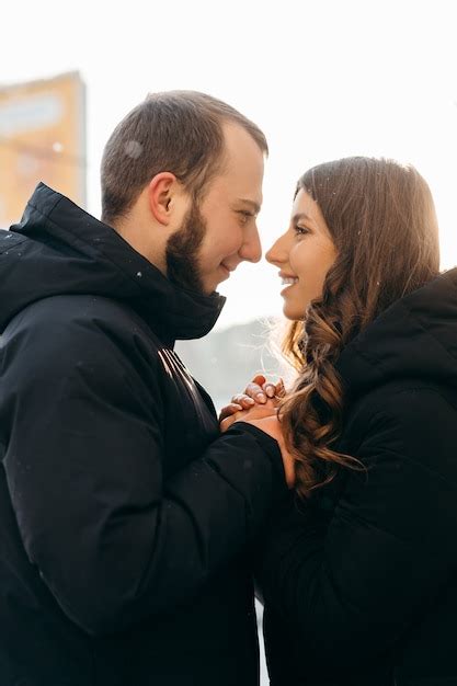 Premium Photo A Man Gently Warms The Hands Of His Beloved Girl In Cold Weather High Quality Photo