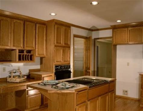 Dab stain onto a cloth and rub the color into the bare wood, in the direction of the wood grain. How to Touch Up Wood Kitchen Cabinets | eHow