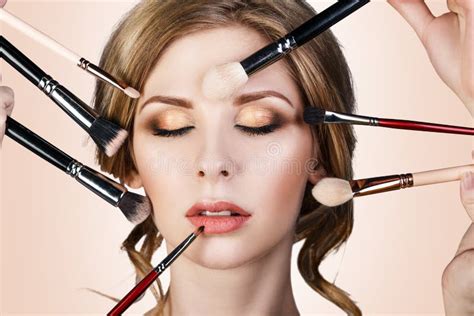 Many Hands Applying Make Up To Glamour Woman Stock Photo Image Of Beige Face