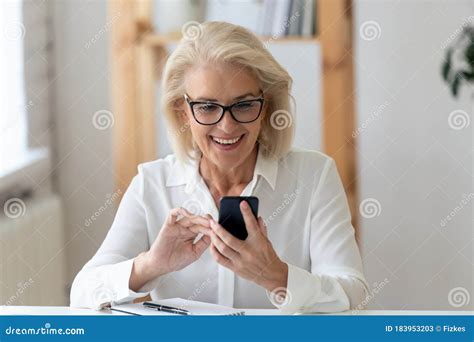 Happy Mature Female Texting On Cellphone Gadget Stock Image Image Of
