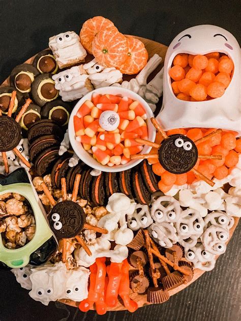 A Festive Af Halloween Themed Snack Board Halloween Themed Snacks Halloween Food For Party