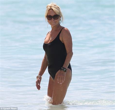 it s a good life in the caribbean for felicity actress looks toned and trim as she takes a dip