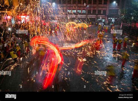 Chinese Entertainers Perform A Fire Dragon Dance In A Shower Of Molten