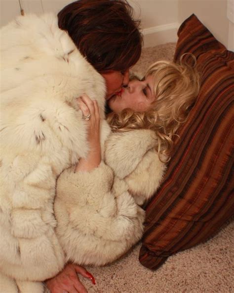 image may contain one or more people lesbians kissing fur coat fashion sweatheart love