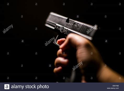 Hand Holding Gun Stock Photos And Hand Holding Gun Stock Images Alamy