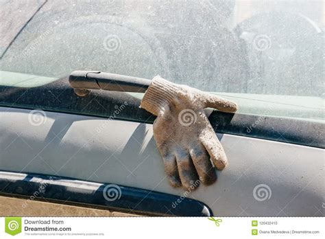 The Glove On The Wiper Blade Cleaning Dirty Glass On The Car Stock