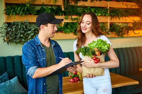 Courier Service Worker Delivering Fresh Food Giving Shopping Bag To A