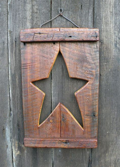 If you are the type who is into using your hands creatively, then you can also use the art of creating beauty with thread work to add to the décor of your stair wall. Primitive Star Wall Decor | Primitive stars, Barn wood ...