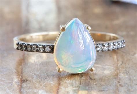 Pear Cut Opal Engagement Ring With Black Gold Pavé Diamond Band