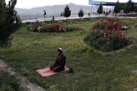 June 4 2014 An Afghan Man Prays In Kabul Mohammed Ismail—reuters