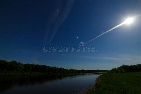 Bright Full Moon In Starry Night Sky Over The River Forest Stock Photo