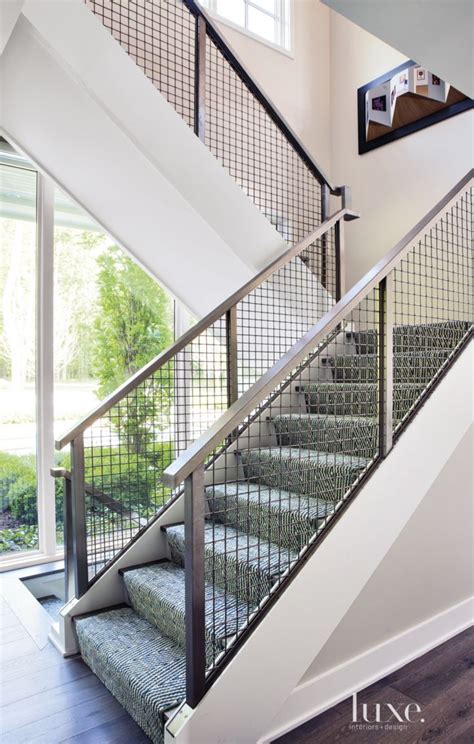 These include iron balusters, stainless railing, wood handrail, newel posts. Contemporary White Staircase with Patterned Runner | Stair ...