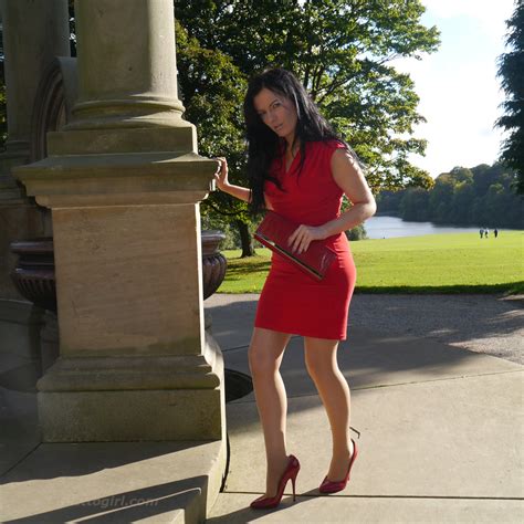 Tricia Takes A Stroll Outdoors Wearing A Tight Red Dress