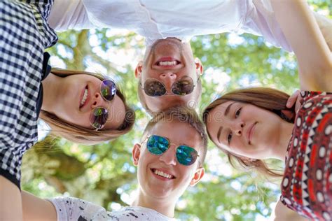 Teenagers Standing In Circle Looking Down At Camera Stock Image Image