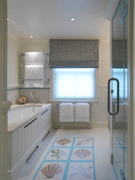 It's bright but warm, reminiscent of a white sand beach on a clear day. Beach Style Bathroom Designs | Beach theme bathroom, Beach ...