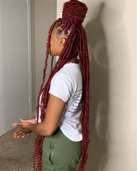 red dreadlocks with extravagant top knot