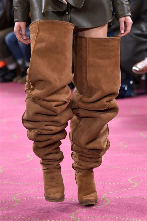 a model in thigh high uggs on a fashion runway uggs slouchy boots fashion