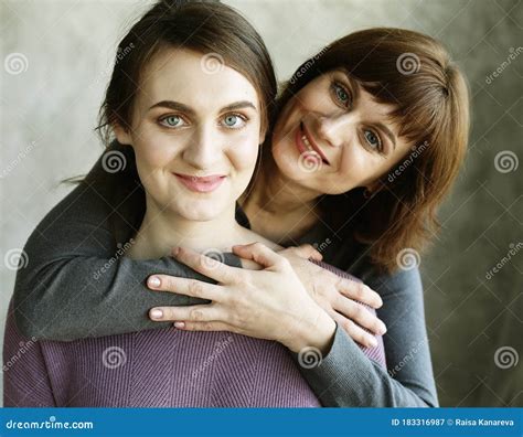 Happy Senior Mother Embracing Adult Daughter Laughing Together Older Lady Hugging Young Woman