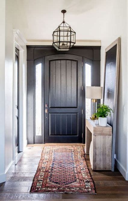 Connecticut farmhouse, staircase and hall in bright north end boise entry foyer with metal candle pendant and vintage black cabinet by maren baker design. Farmhouse entryway lighting mirror 35 ideas | Foyer ideas ...