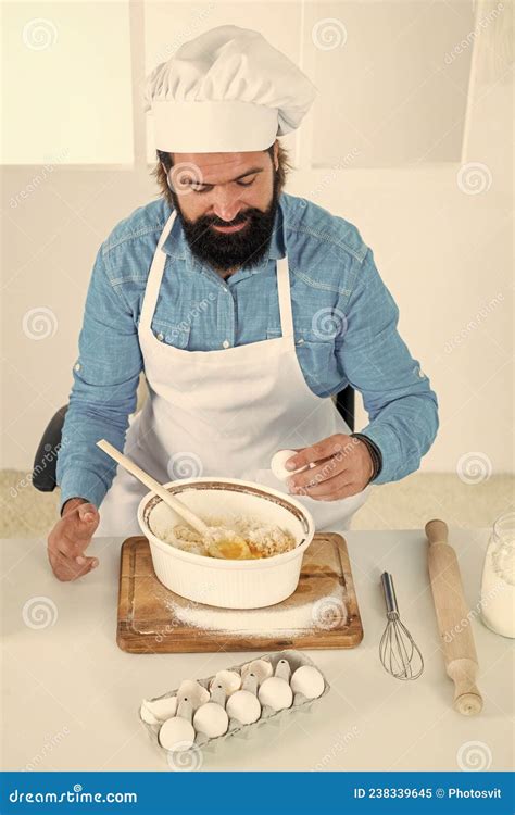 Brutal Hipster With Moustache And Beard In Apron Cooking Meal Cooking By Recipe Stock Image