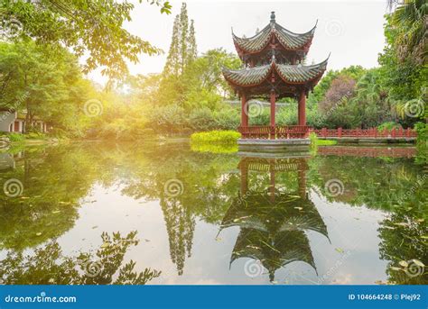 Chinese Pavilion Reflecting In A Pond In Baihuatan Public Park Stock Photo Image Of Garden