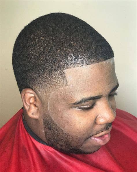 Some men will cut off their curls while others embrace it like in this style. 26 Fresh Hairstyles + Haircuts for Black Men in 2020