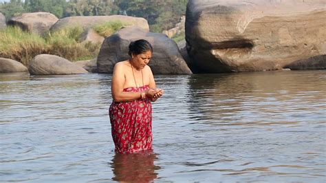 Hampi India 28 January 2015 Indian Woman Standing In The River And Taking Bath Stock Video