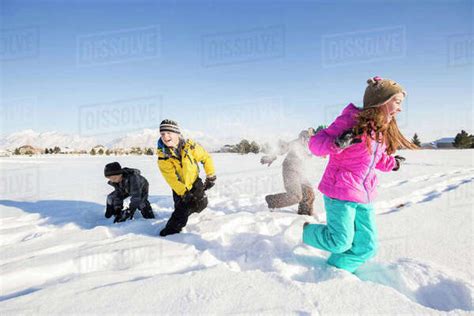 Children 8 9 10 11 Playing In Snow Stock Photo Dissolve