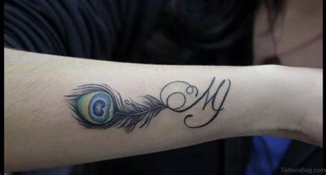 31 Awesome Peacock Feather Tattoos On Wrist