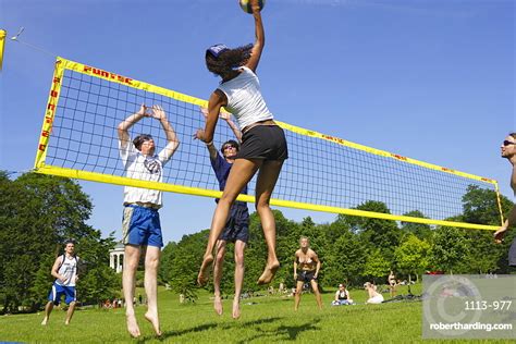 People Playing Volleyball In The Stock Photo