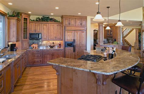 By continuing to browse our website, you are agreeing to our use of cookies. Colorado Style Kitchen with granite raised bar island and ...