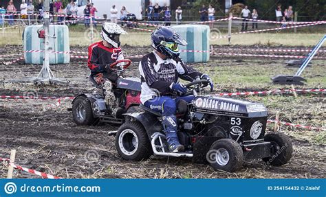 Overtaking In A Race With Tuned Lawn Mowers On A Mud Track In A Potato