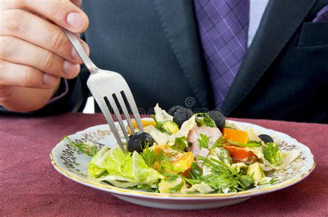 Man Eating Hand With Fork Salad On Plate Closeup Stock Photo Image